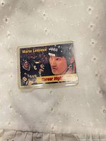 Front of Mario Lemieux trading card in protective sleeve