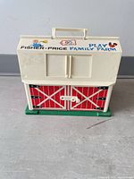 Front view of Fisher-Price Play Family Farm barn carry-case
