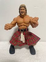 Front view showing full figure with kilt and boots