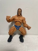 Front view of 14-inch Triple H action figure standing