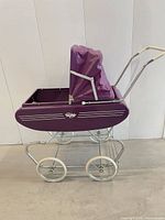 Side view of purple Gendron metal doll buggy with canopy raised