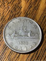 Reverse showing canoe design and 1953 date