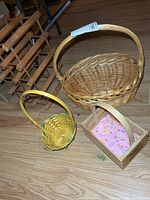 All three baskets grouped on floor