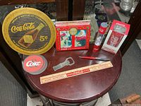 Full view of all eight Coca-Cola items on table