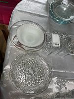 Group shot showing Fire-King bowl, pressed glass plate, gold-rim plate, and five tumblers