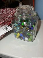 front view of jar filled with marbles