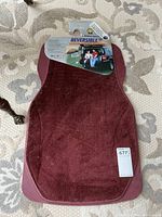 Front view of burgundy carpeted floor mat on original hanger card