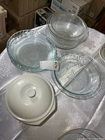 Group shot of pie plates, mixing bowls, covered dish