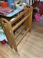 Full side view of wooden quilt rack