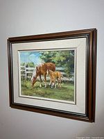 Full view of framed Ruth Brooks horse painting on wall
