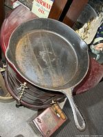 Top view of Smarts cast iron frying pan showing interior, pour spouts and handle