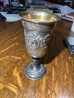 Full view of sterling goblet showing overall form and patina