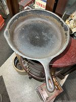 Top view of Wagner Ware No.10 cast iron frying pan showing interior surface and handle