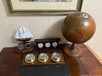 All four nautical themed decor items grouped on tabletop