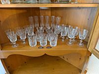 Wide shot of entire shelf showing all crystal pieces grouped
