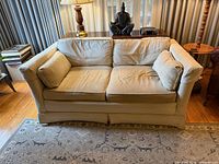 Front view of Drexel beige upholstered sofa