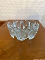 Angled view showing petal-like lobes and clarity of glass