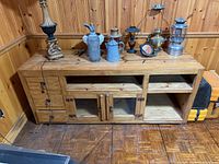 Front view showing full cabinet, drawers, open shelves, glass doors