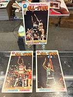 Group shot of all three 1976-77 Topps All-Star cards laid out on counter