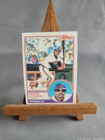 Front view of the 1983 Topps Reggie Jackson #500 card on easel