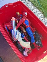 Bin overview with action figures, toy gun, cars