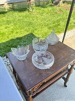 All four crystal pieces on tabletop outdoors