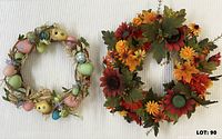 Front view of Easter egg wreath and fall floral wreath side by side