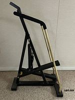 Side profile showing overall frame and piston mechanism