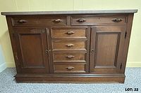 Front view showing drawers, doors, marble top