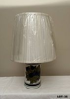 Lamp assembled with shade wrapped in protective plastic