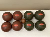Top view of eight bocce balls and pallino