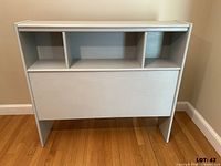 Front view showing cubbies and panel