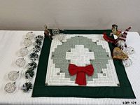 All items arranged: quilt, wire ornaments, greenery wreaths, assorted ornaments