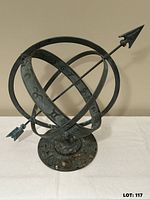 Front angled view showing intersecting rings, arrow gnomon, base