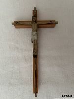 Front view of wooden crucifix with metal corpus