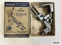 Attachment in open box beside lid showing graphics and specifications