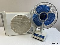 Table fan and window fan side by side for size and style reference
