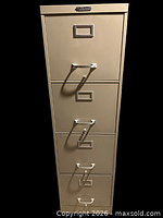 Front view of beige steel 4-drawer filing cabinet showing drawers and pulls