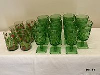 Group view of all 17 green glasses on table