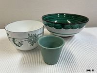 Front view of all three vessels: white Arabia bowl, green glazed terracotta bowl, small green plant pot