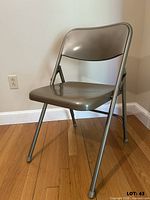 Front angled view of unfolded metal folding chair