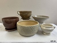 Group shot of all five ceramic pots showing variety of shapes and glazes