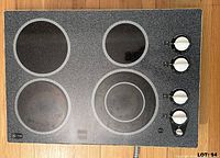 Top view showing four elements, control knobs, GE Profile logo