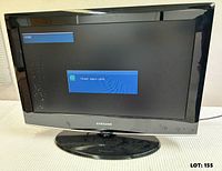Front view of powered-on Samsung 26" LCD TV, screen displaying system message