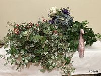 All items in lot: ivy basket, flower arrangement, potted greenery, cat figurine