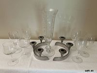 Group shot showing vase, two circular candle holders, and stemmed glasses