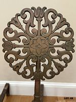 Close-up of pierced brass medallion detail