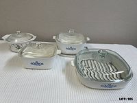 Four lidded dishes showing patterns and lids