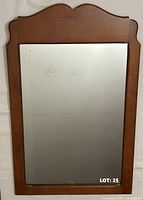 Front view of rectangular mirror with wood frame