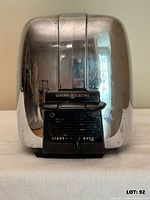 Front view showing GE logo, lever and browning control